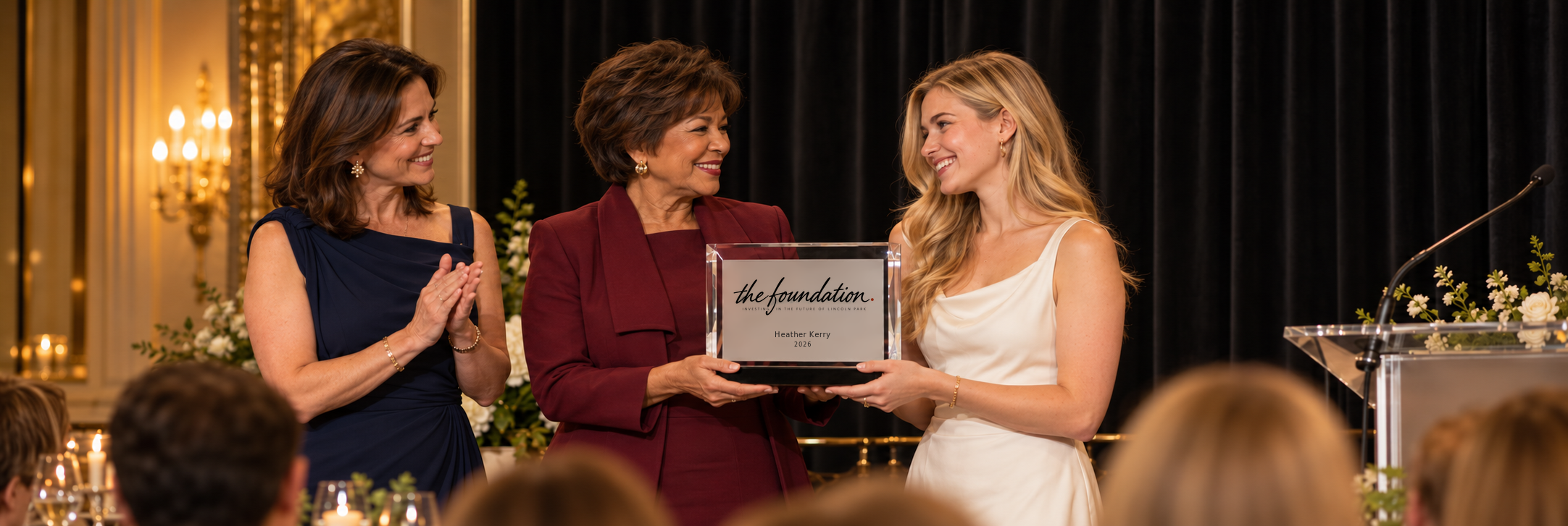 Heather Kerry receiving the 2026 Foundation award from a board member and civic leader